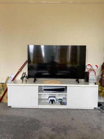 Image 1 of TV stand with storage in perfect condition. Selling because