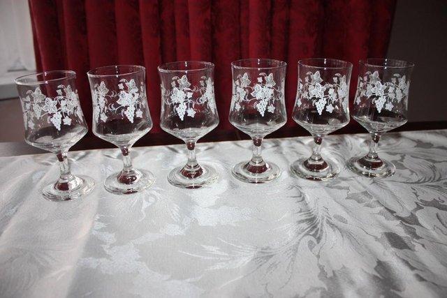 Preview of the first image of 6 Wine glasses engraved with grape vines.