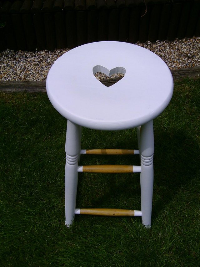 Preview of the first image of Wooden bar stool with carved heart seat.