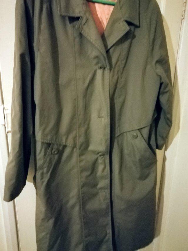 Preview of the first image of Ladies lightest grey trench rain coat.