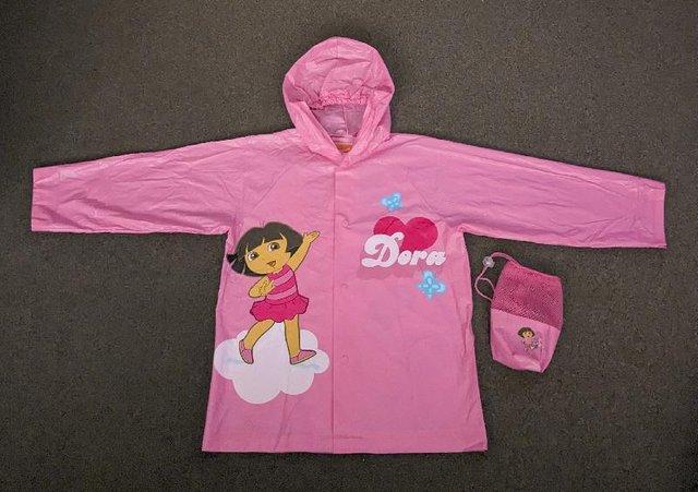 Preview of the first image of Dora The Explorer PVC Rain Coat & Storage Bag - Size S/M.