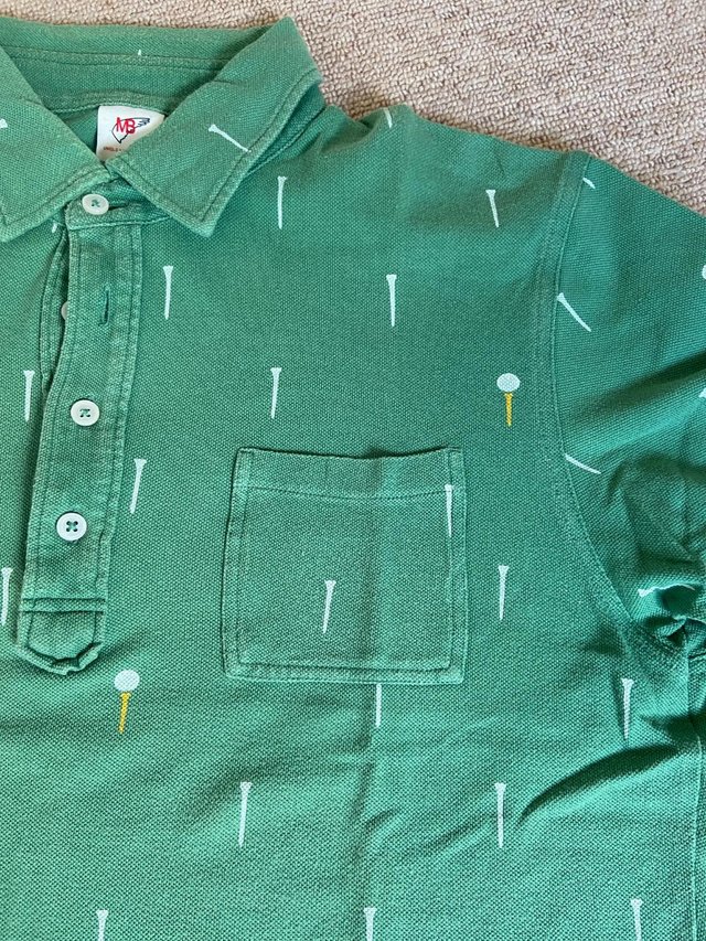 Preview of the first image of mens golfing green polo shirt.