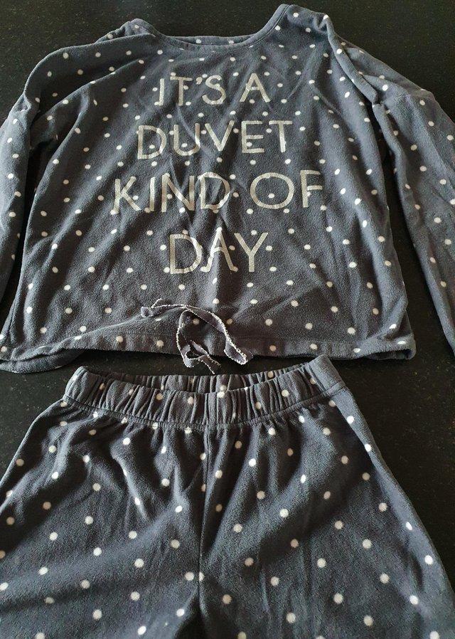 Preview of the first image of Grey polka dot fleece long sleeve pyjamas size 8-10.