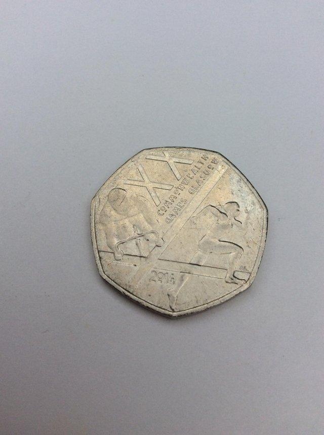 Preview of the first image of Commonwealth 50 pence coin piece.