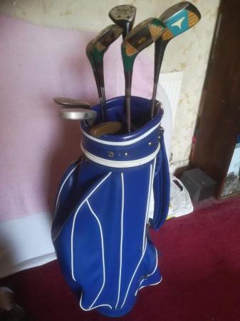 Image 1 of Golf bag with assortment of 5 woods driver &2putters blue go