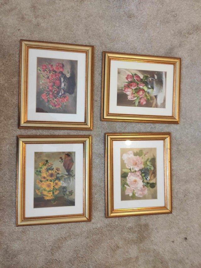 Preview of the first image of Set of four, gold framed flower small prints.