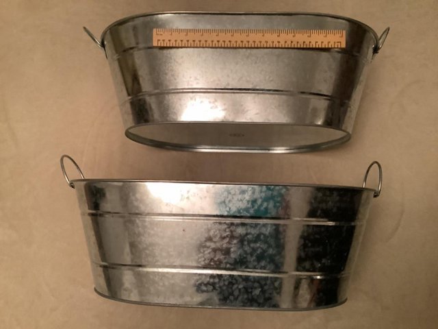 Preview of the first image of 2 GALVANISED STEEL OVAL ICE/BOTTLE BUCKETS.