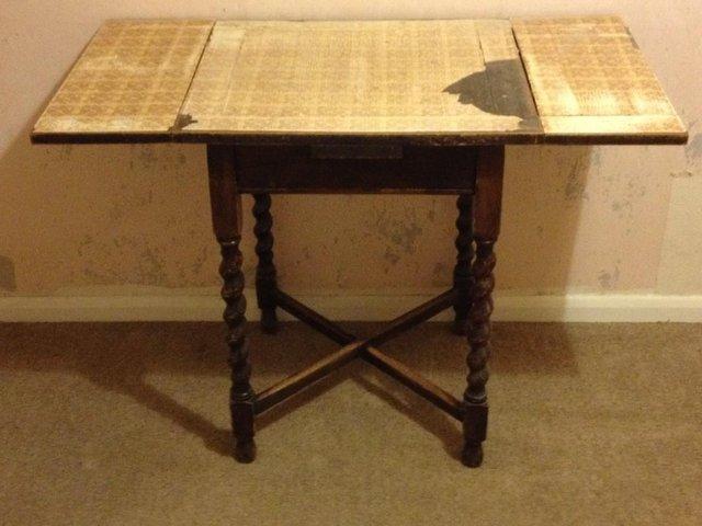 Preview of the first image of Vintage Small pull out extending Oak table with scroll legs.