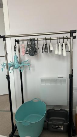 Image 2 of Two garment rails with 60 hangers, together with 2 buckets,
