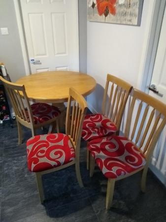 Image 3 of Light coloured wooden extending Dining Table and four chairs