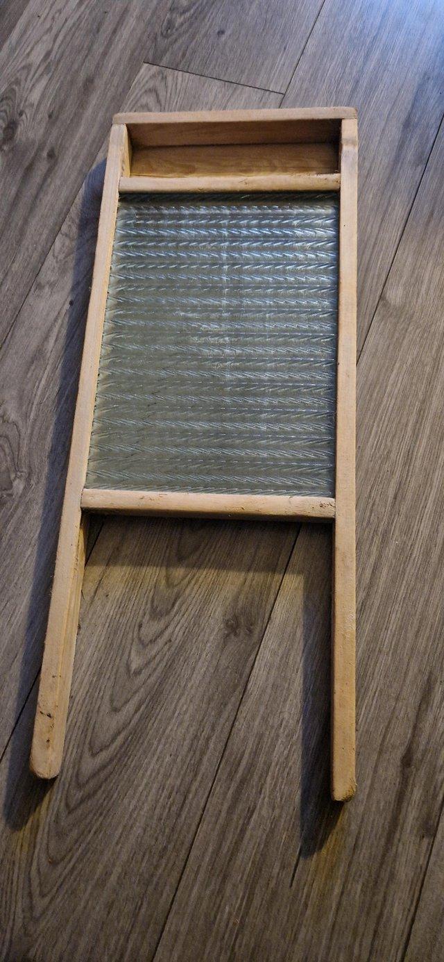 Preview of the first image of Antique vintage washboard with rippled glass.
