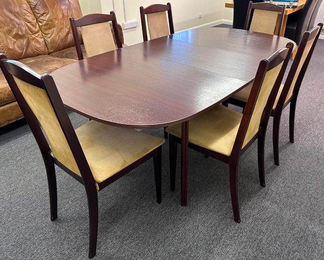 Preview of the first image of MAHAGONY DINING TABLE AND 6 CHAIRS.