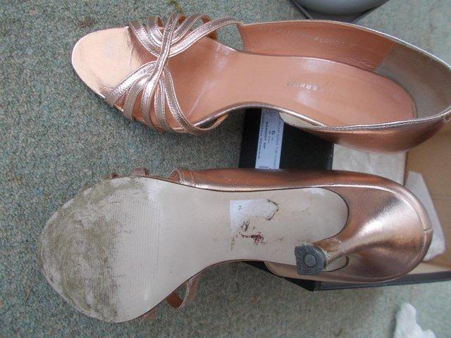 Preview of the first image of Dorothy Perkins, pink gold court shoes Size 6.