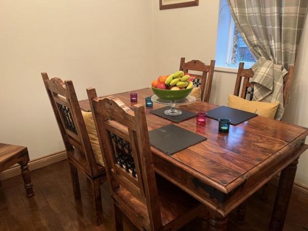 Image 1 of Hardwood table and matching 6 chairs