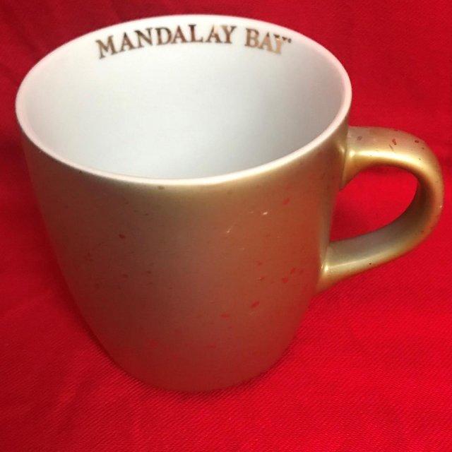 Preview of the first image of Mandalay Bay (Las Vegas) gold coloured glittery mug.