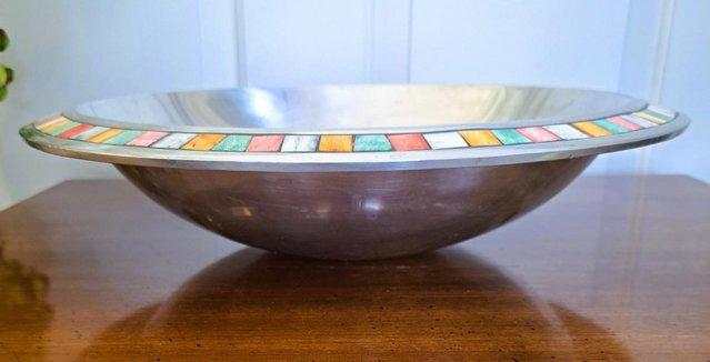 Image 2 of A large metal bowl with a pretty edging