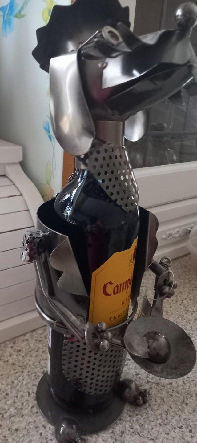 Preview of the first image of NOVELTY METAL WINE BOTTLE HOLDER - DOG CHEF.