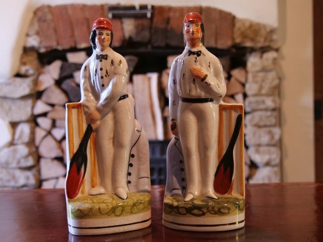 Preview of the first image of Pair of vintage Staffordshire-style pottery cricketers.