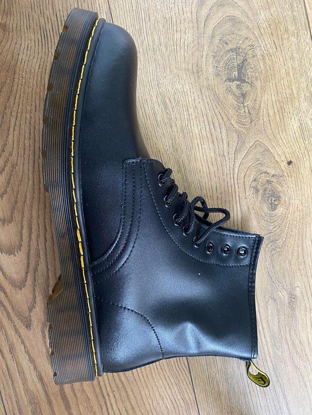 Preview of the first image of Brand New men’s faux leather size 10 boots.