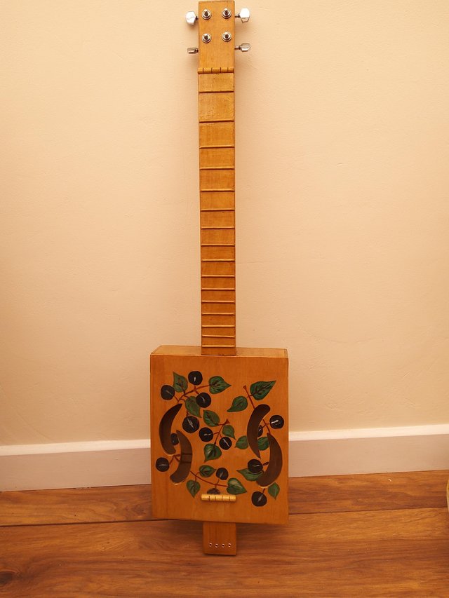 Preview of the first image of Handmade  painted and varnished box guitar.