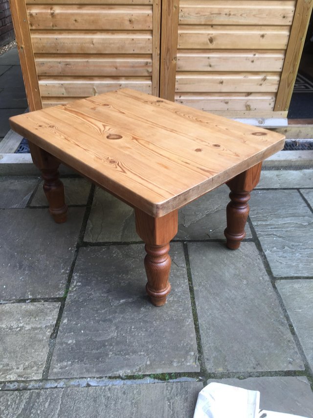 Preview of the first image of A very sturdy low pine table with turned legs..