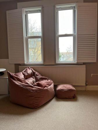 Image 1 of Pink velvet beanbag and footstool