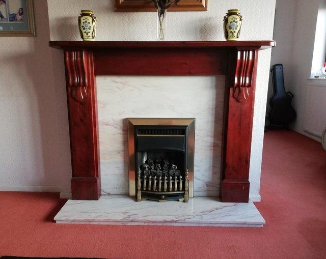 Preview of the first image of Polished wood and marble fire surround.