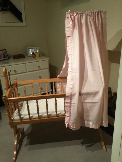 Preview of the first image of Wooden swinging crib in lovely condition.