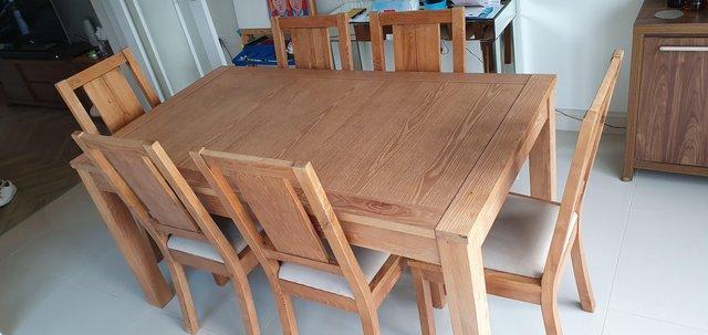 Preview of the first image of Modern oak 6/8 dining table with 6 chairs and glass top.