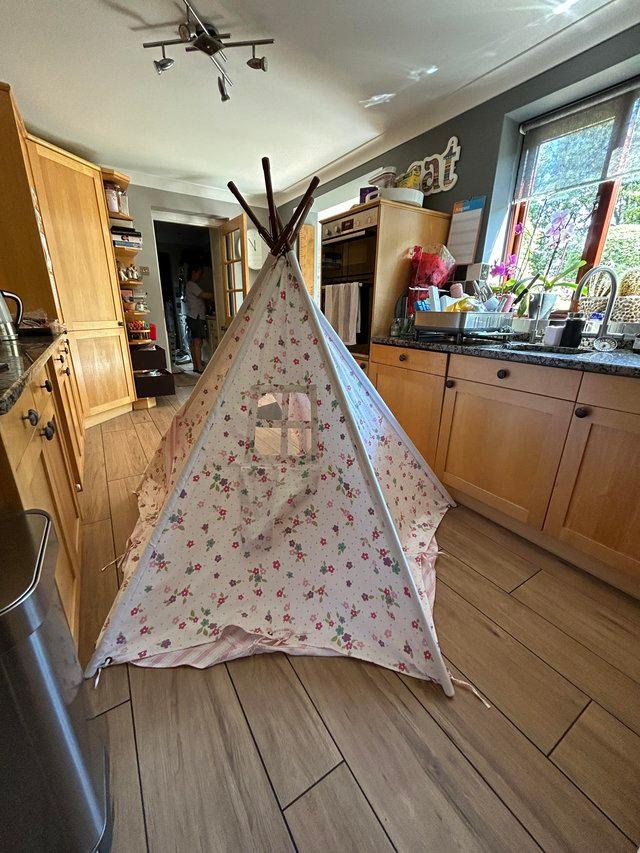 Preview of the first image of Children’s floral and stripe play teepee tent.