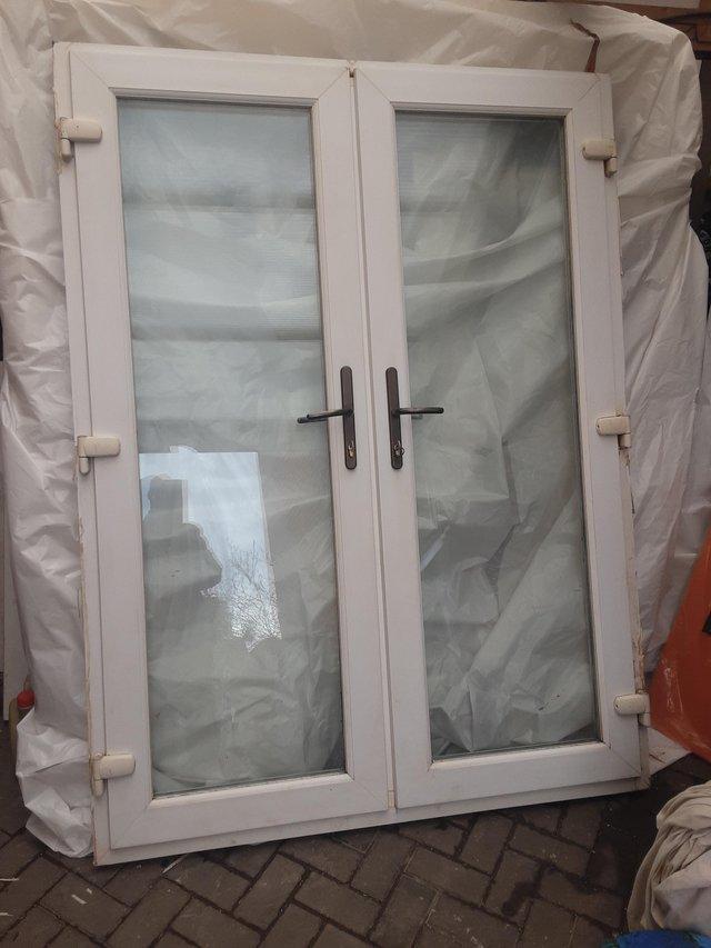 Preview of the first image of Pvc french doors mint like new.
