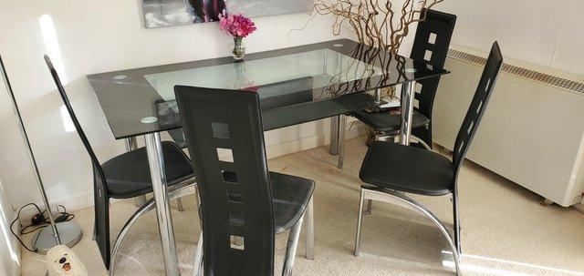 Image 1 of Glass Dining Table With shelf.underneath