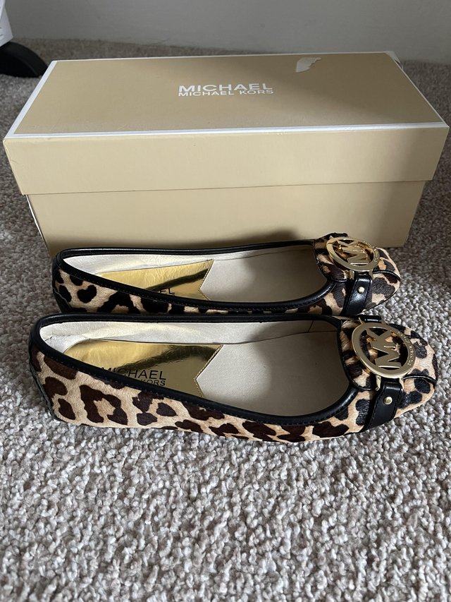 Preview of the first image of Size 3 Michael Kors Leopard Shoes.