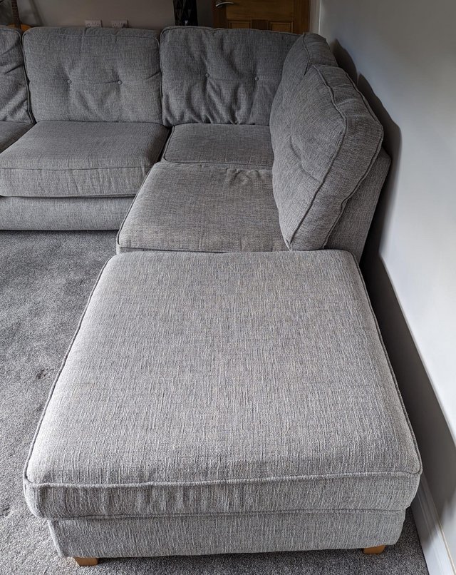 Preview of the first image of Large grey corner sofa with footstool.