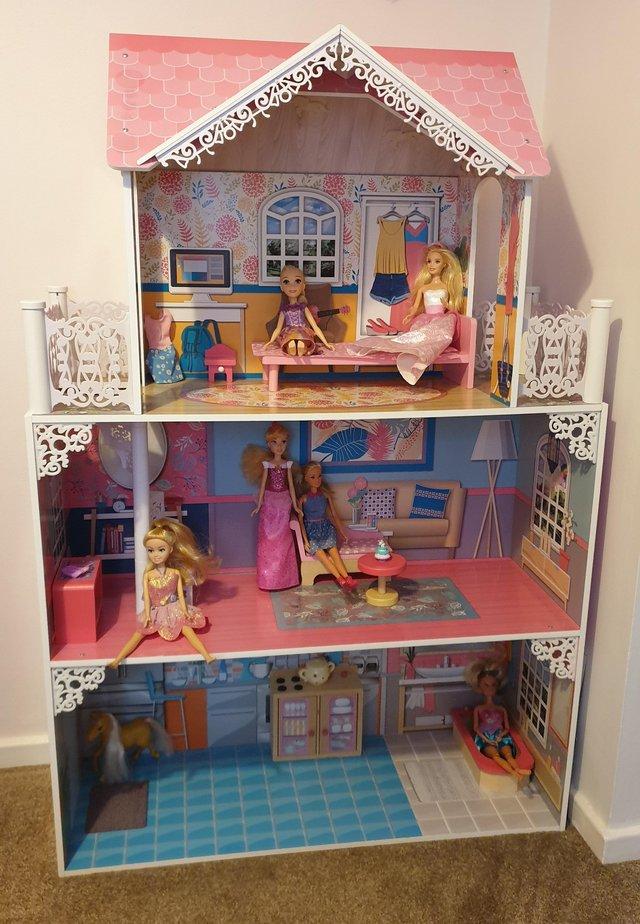 Preview of the first image of Dolls House including dolls and furniture.