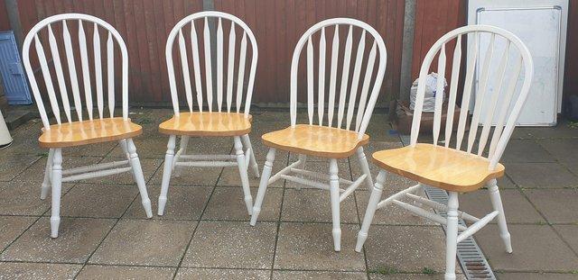 Preview of the first image of Country style wooden dining chairs x 4.