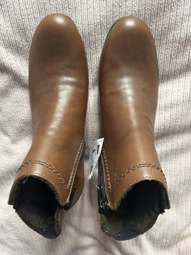 Preview of the first image of Reiker brown ankle boot with zip detail BNWT.