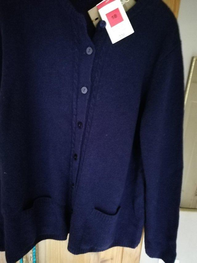 Preview of the first image of Marks and spencers purple cardigan.