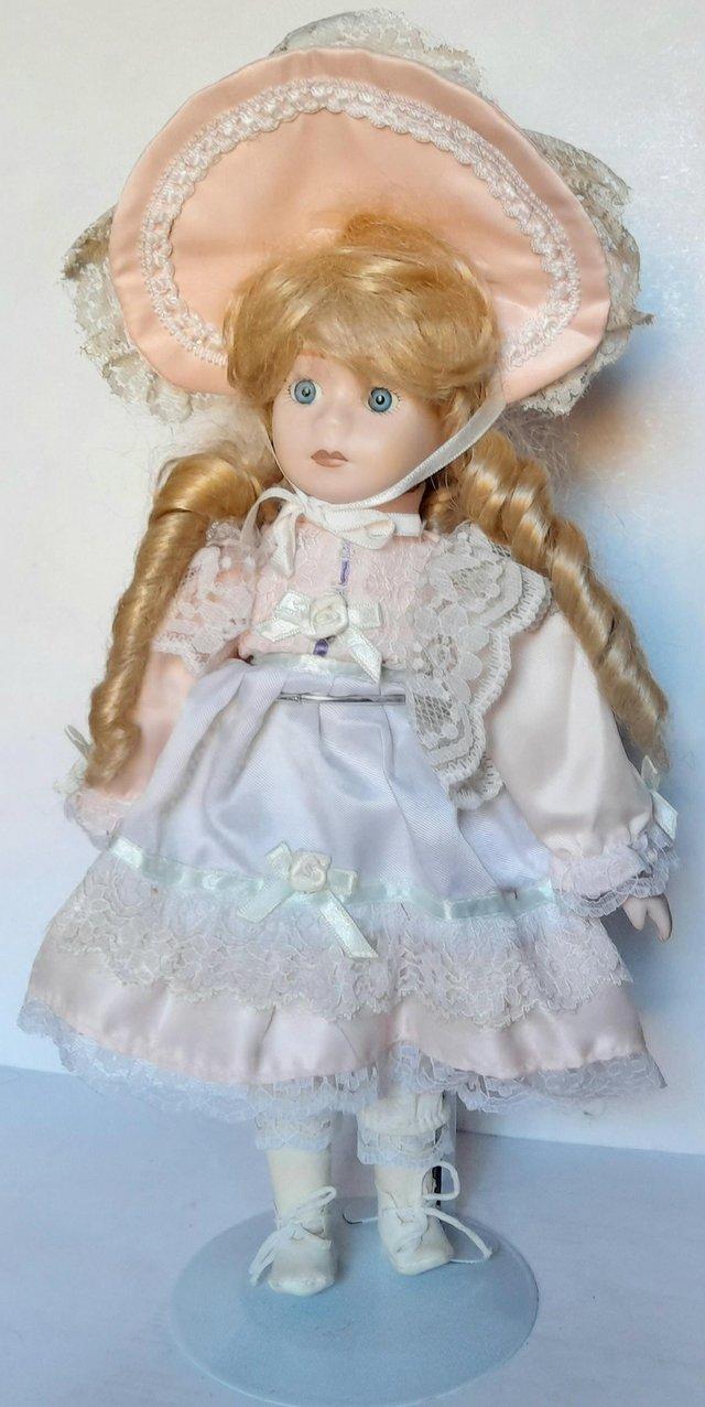Preview of the first image of RACHEL A PORCELAIN DOLL - PINK LACY DRESS 32 cm.