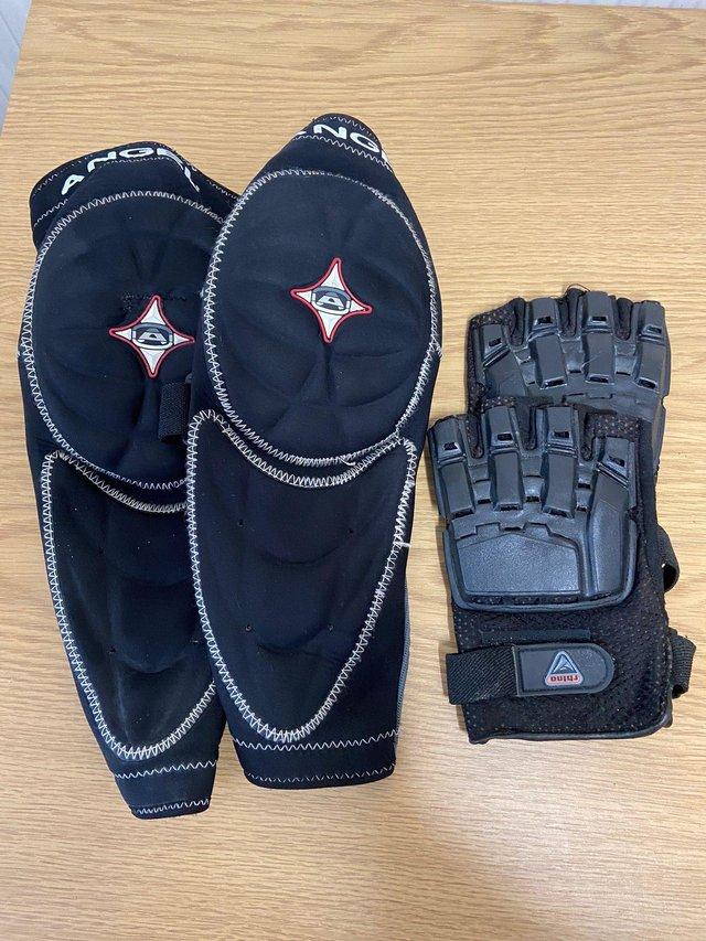 Preview of the first image of Black Angel forearm pads plus Rhino Black gloves.