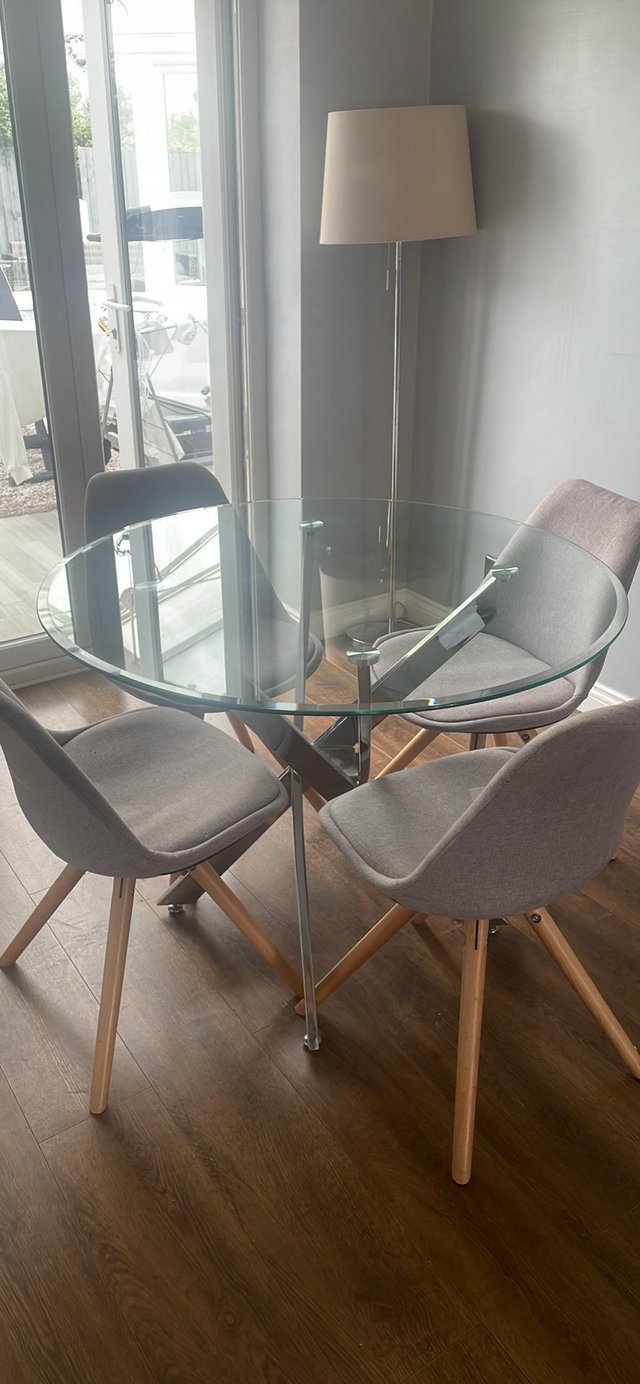 Preview of the first image of Stylish glass and chrome dining table.