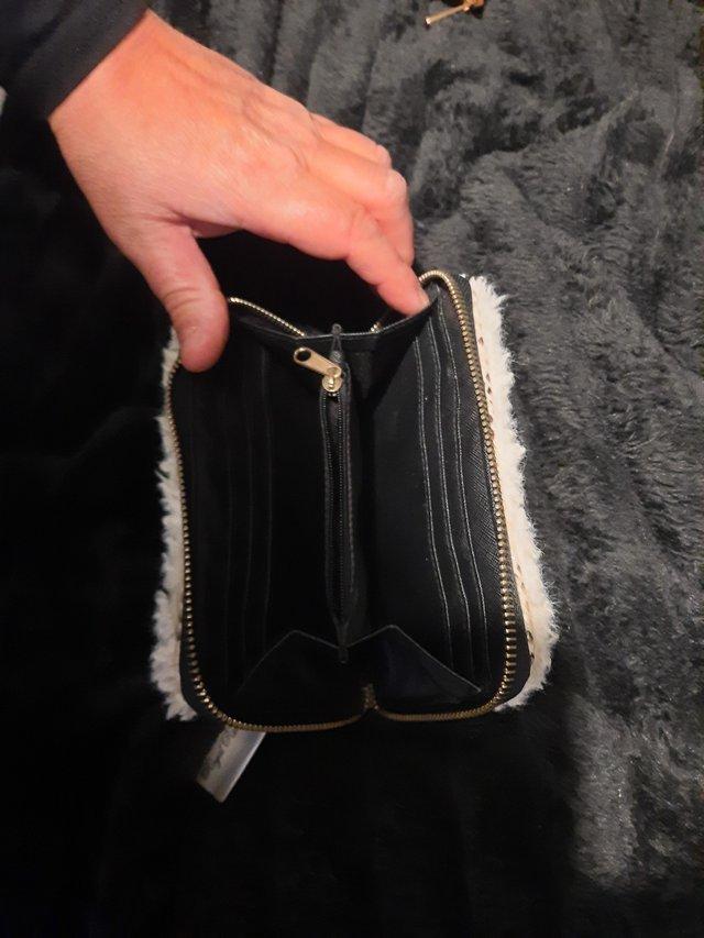Preview of the first image of Ladies river island purse.