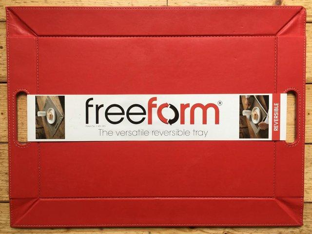 Preview of the first image of Unused reversible red/beige freeform faux leather tray..