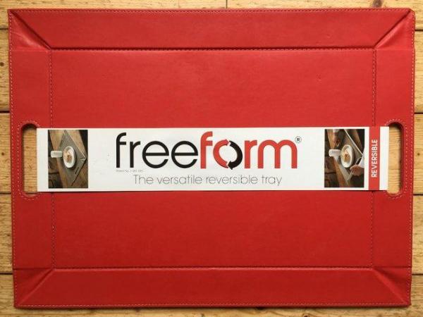 Image 1 of Unused reversible red/beige freeform faux leather tray.