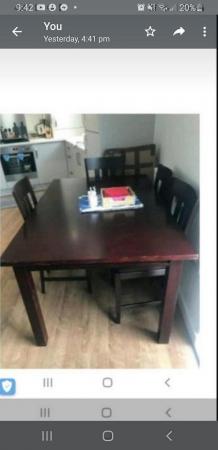 Image 1 of Designer dark wooden dining table and chairs