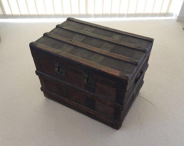 Preview of the first image of Vintage Wooden Travel Trunk with Metal Metal Banding.