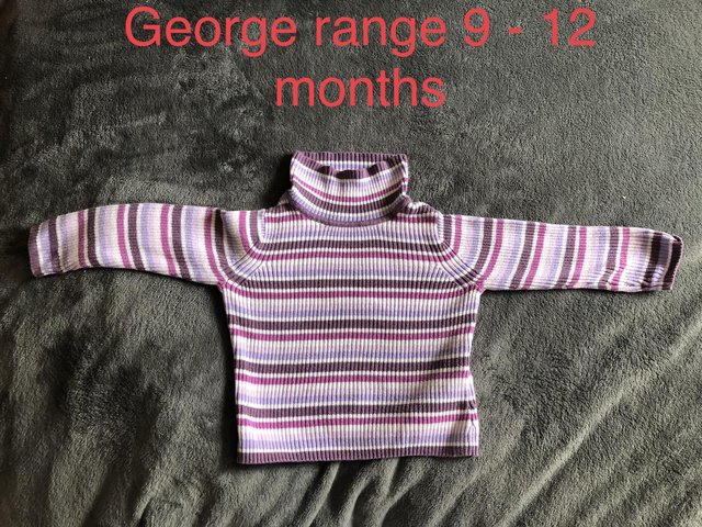 Preview of the first image of Baby girls stripped jumper.