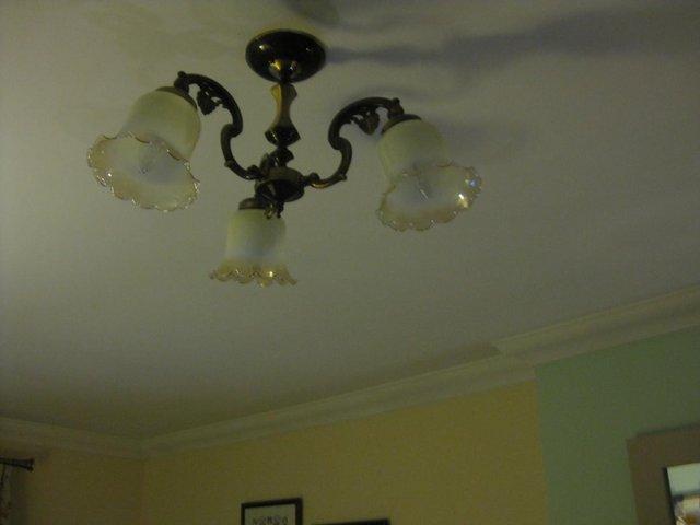 Preview of the first image of brass flushed ceiling light with 3 bulbs.