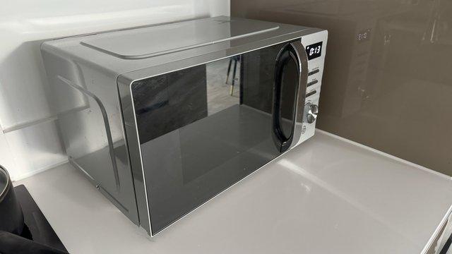 Image 1 of 6 months used microwave oven