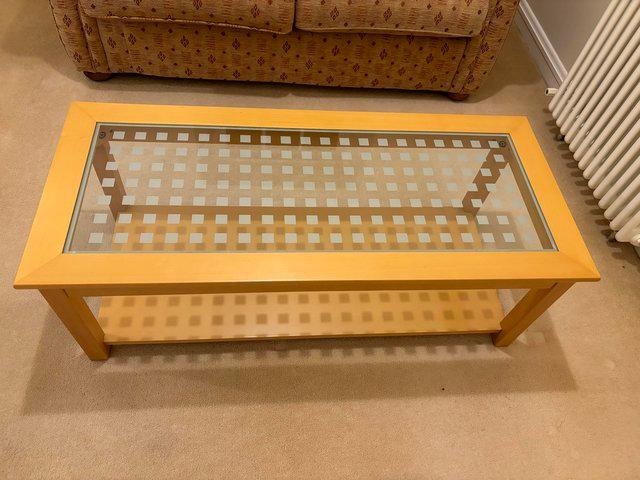 Preview of the first image of Wooden framed and glass centre coffee table.